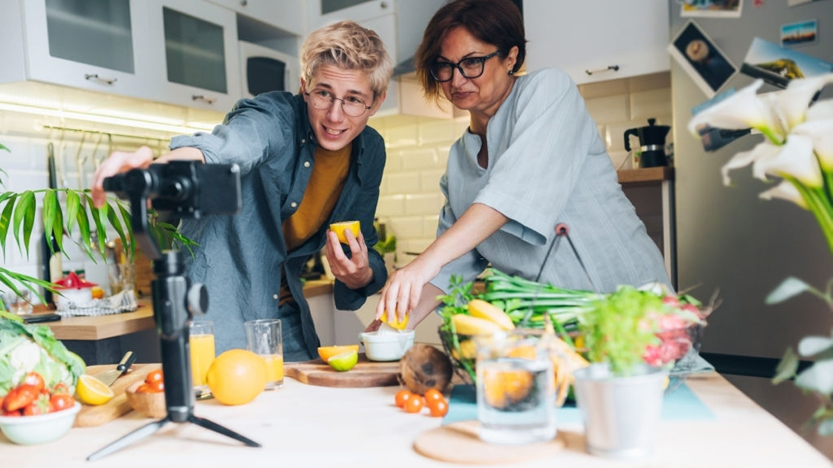 a mother with her son are making video cooking training