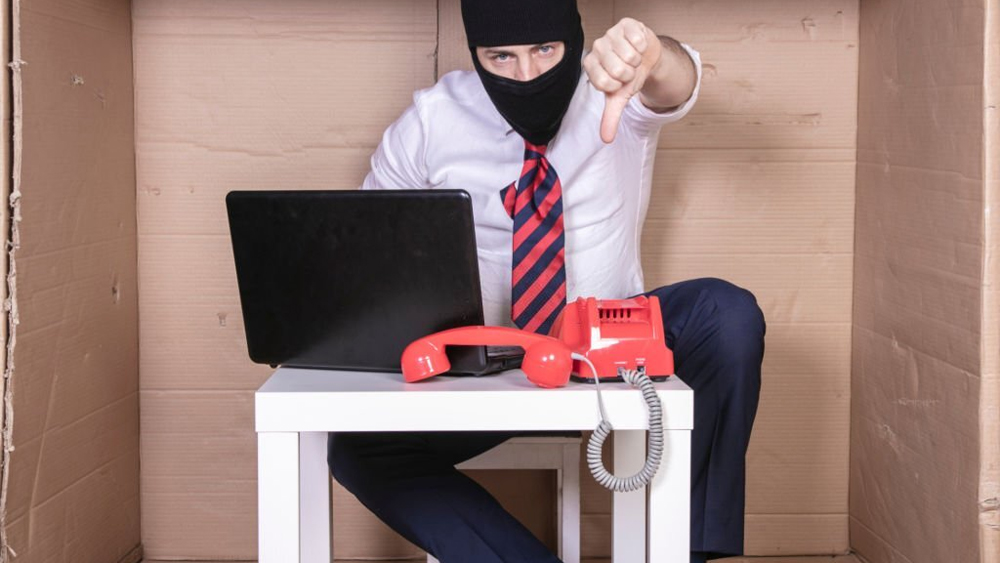Secret employee fights cybercriminals shows thumbs down