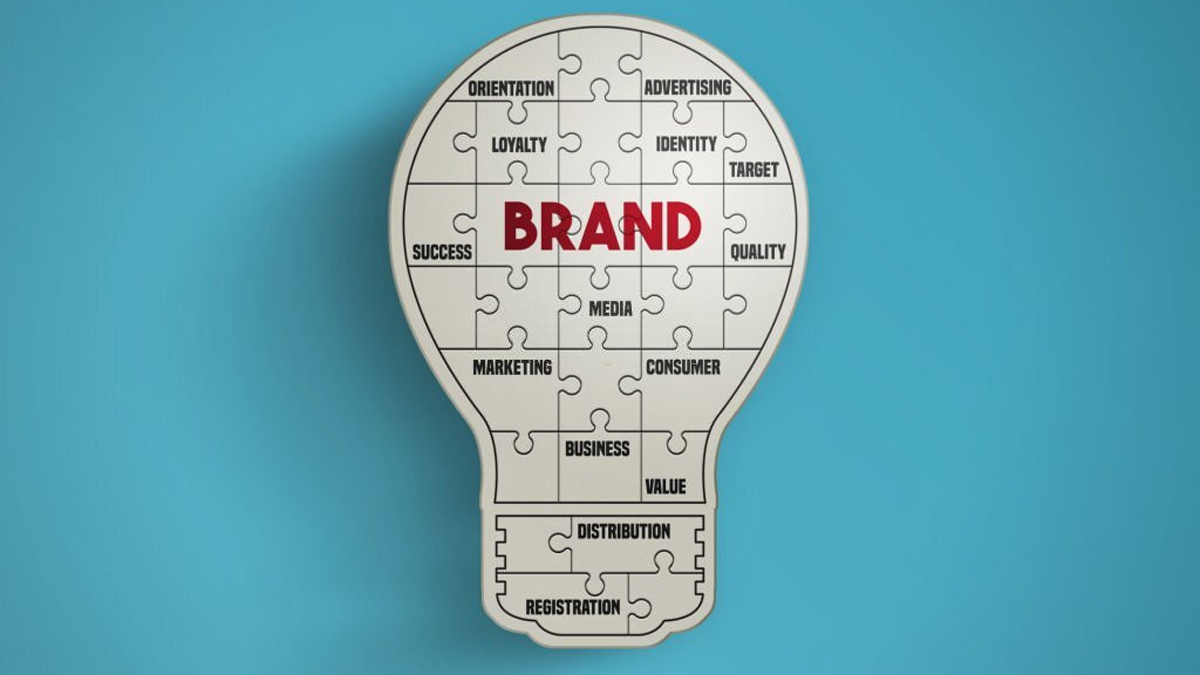 Light bulb puzzle pieces forming the word brand