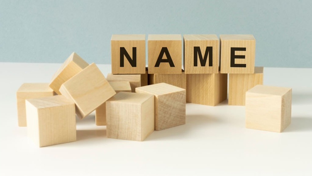 Word name on wooden cubes letters