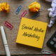 Social media marketing written on sticky notes
