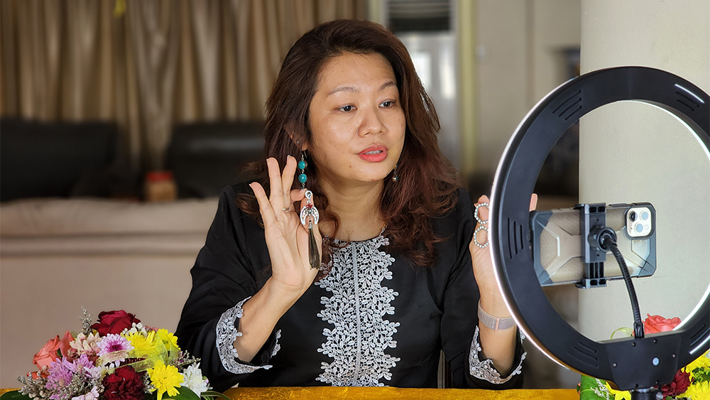 Woman recording video to post on social media