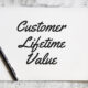 Selective focus notebook written customer lifetime value