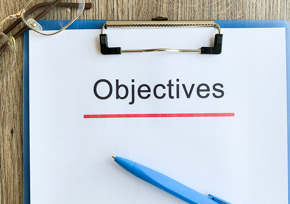 Objectives word written on a paper