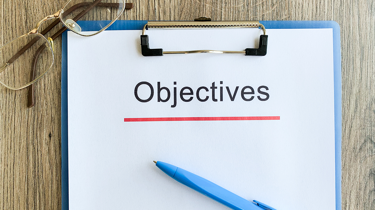 Objectives word written on a paper