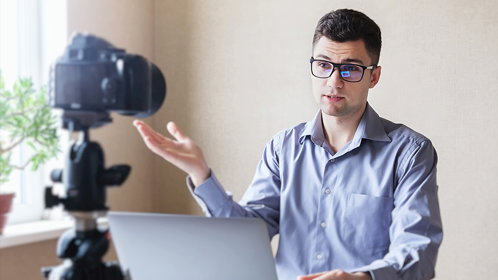 Young man holding a webinar