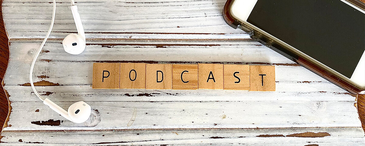 Podcast word written on wooden cubes