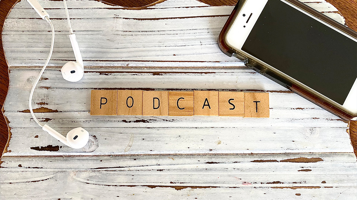 Podcast word written on wooden cubes