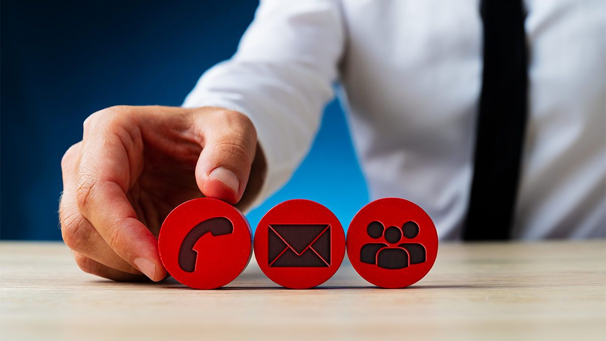 Man holding call-to-action wooden buttons