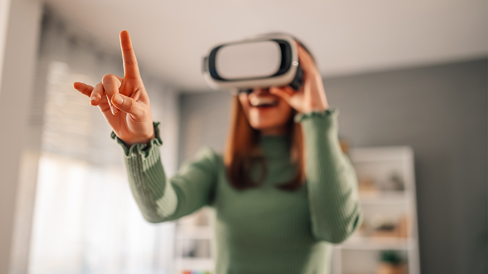 Woman using a virtual reality glass and pointing with finger