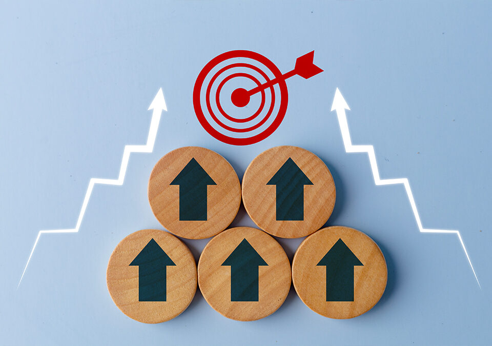 Business growth success achievement concept shown with up arrows on the wooden circles getting closer to the target sign
