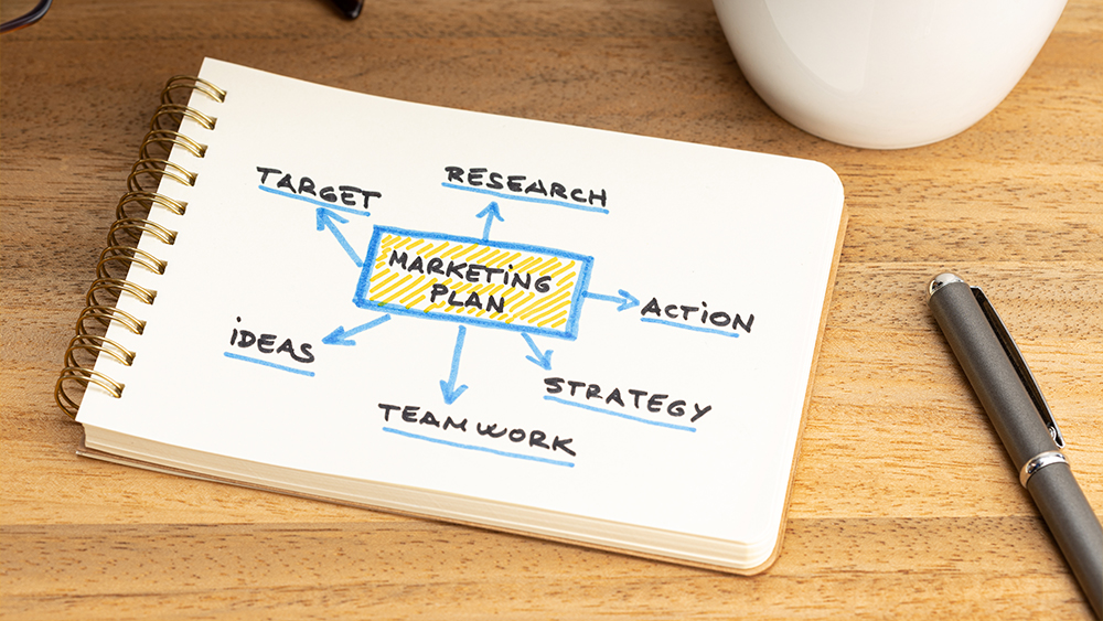 Marketing plan graph on notepad