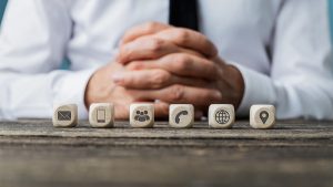 Communication ways icons on tiny wooden cubes