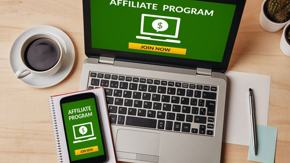 Affiliate program concept on laptop smartphone screen