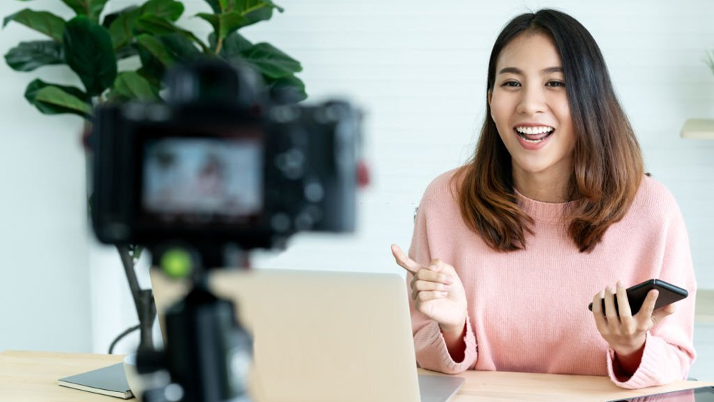 Woman blogger vlogger looking camera talking